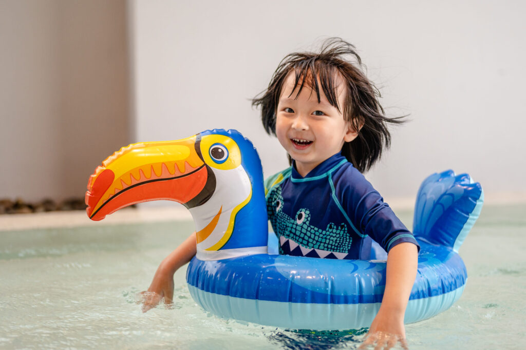 portrait of little boy in swimming pool on funny i 2023 11 27 04 57 13 utc