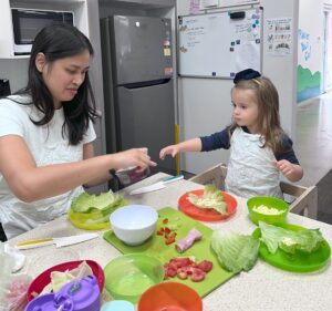 Child participating in a kitchen skills session with occupational therapist