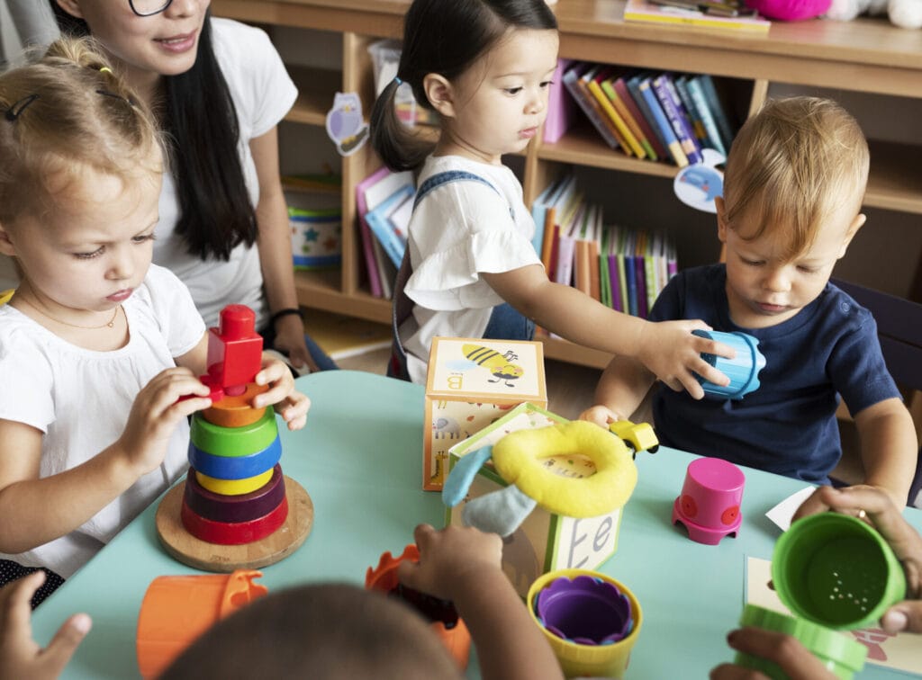 nursery children playing with teacher in the 2025 02 10 01 40 31 utc
