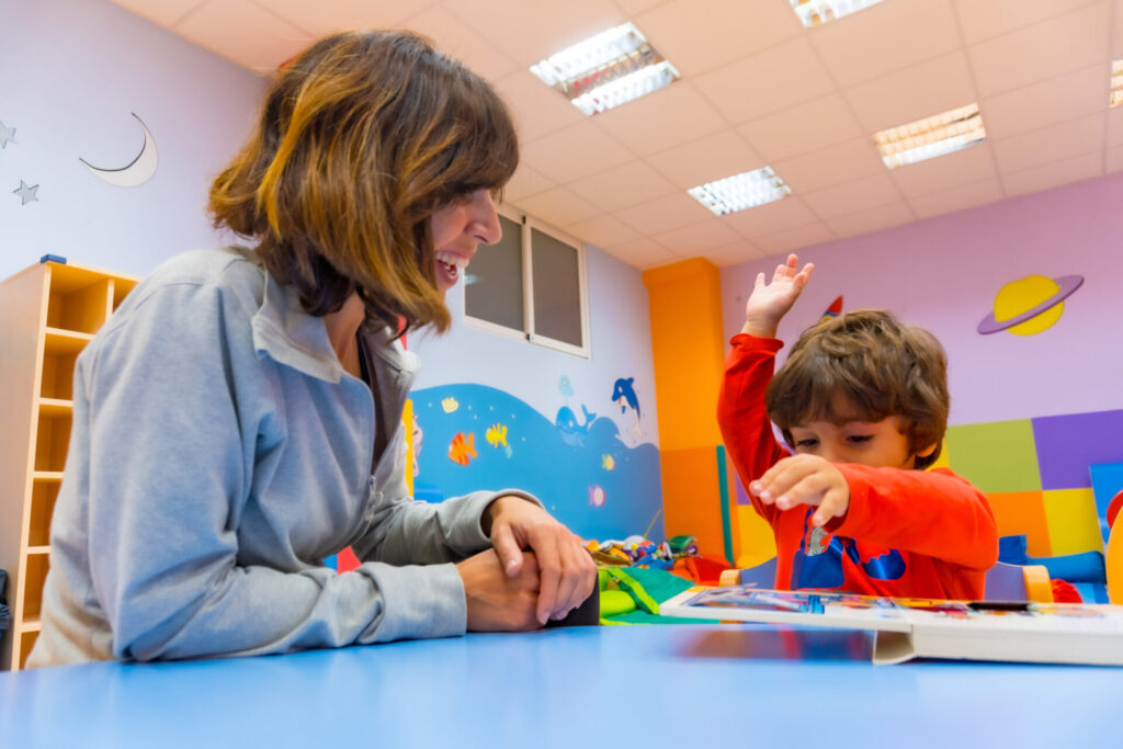 portrait of a female teacher with a child sitting 2026 01 07 05 48 25 utc