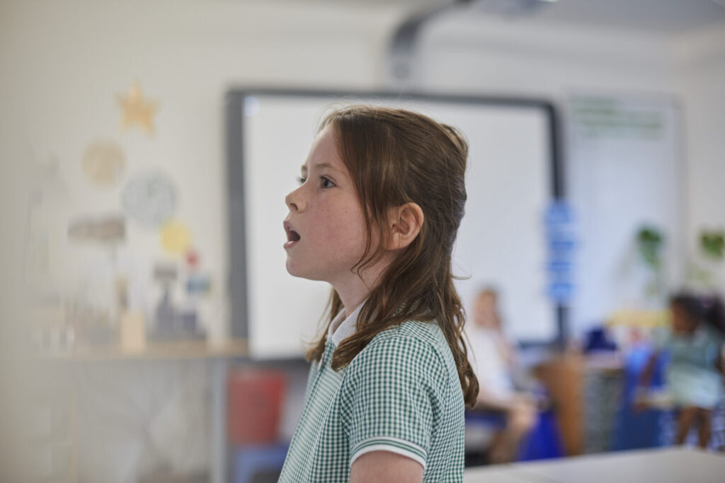 young girl speaking in a classroom setting 2026 01 09 10 01 55 utc